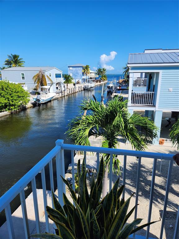 31547 Ave D Big Pine Key, FL 33043 - Photo 28 of 42 a view of a balcony with chairs