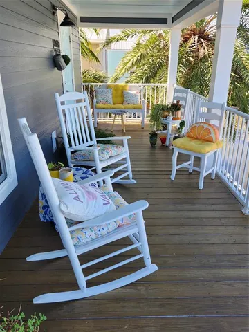 a view of a chairs and table in patio