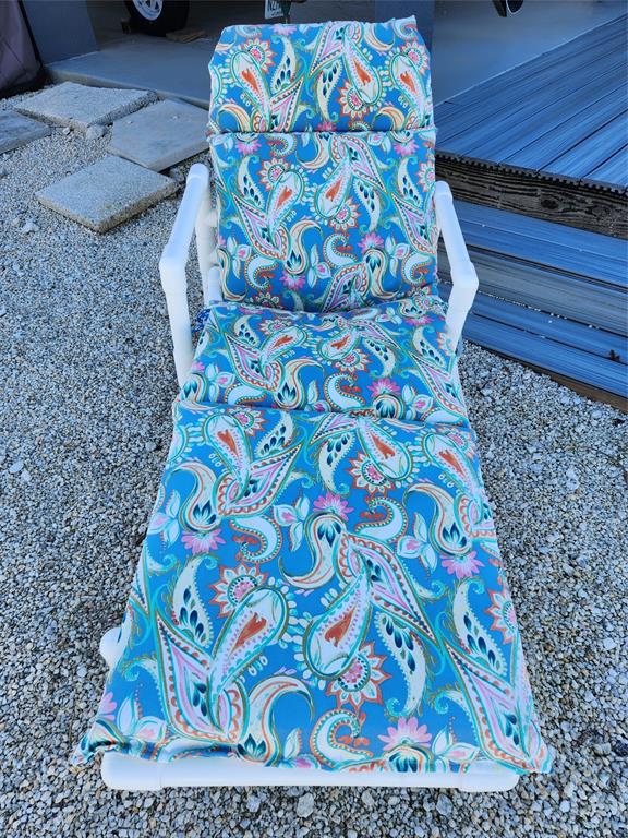 31547 Ave D Big Pine Key, FL 33043 - Photo 30 of 42 a bedroom with a bed and a painting on the wall