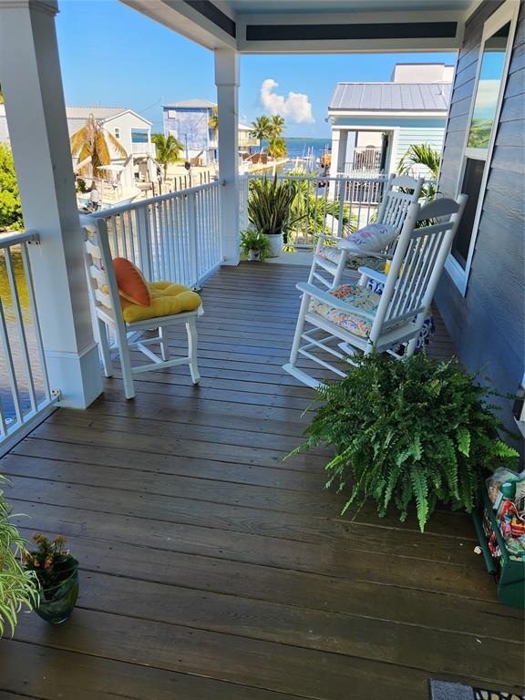31547 Ave D Big Pine Key, FL 33043 - Photo 31 of 42 a view of a chairs and table in patio