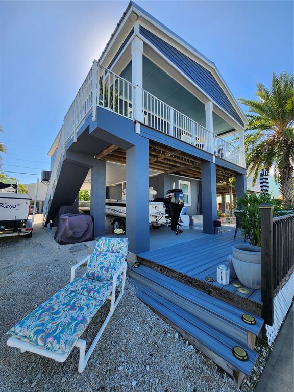 31547 Ave D Big Pine Key, FL 33043 - Photo 32 of 42 a view of a house with a patio