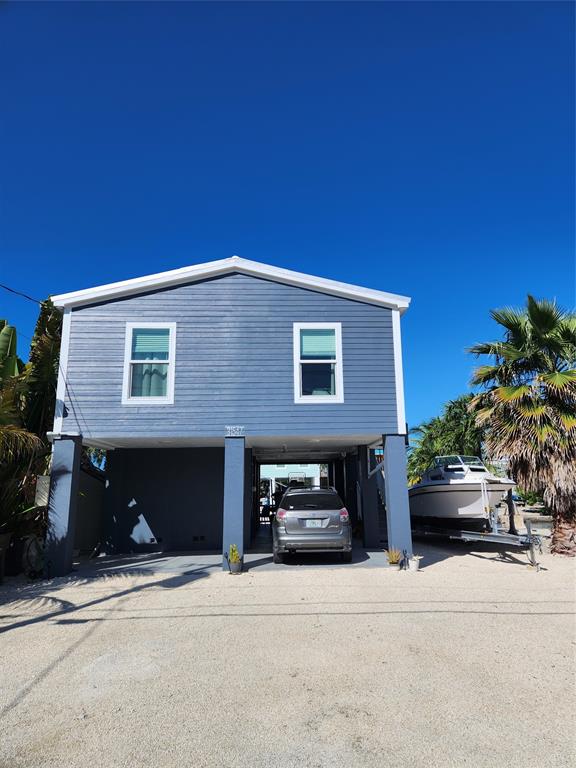 31547 Ave D Big Pine Key, FL 33043 - Photo 39 of 42 a front view of a house with a yard