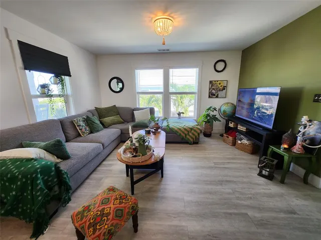 a kitchen with stainless steel appliances granite countertop a refrigerator a stove a sink and a microwave