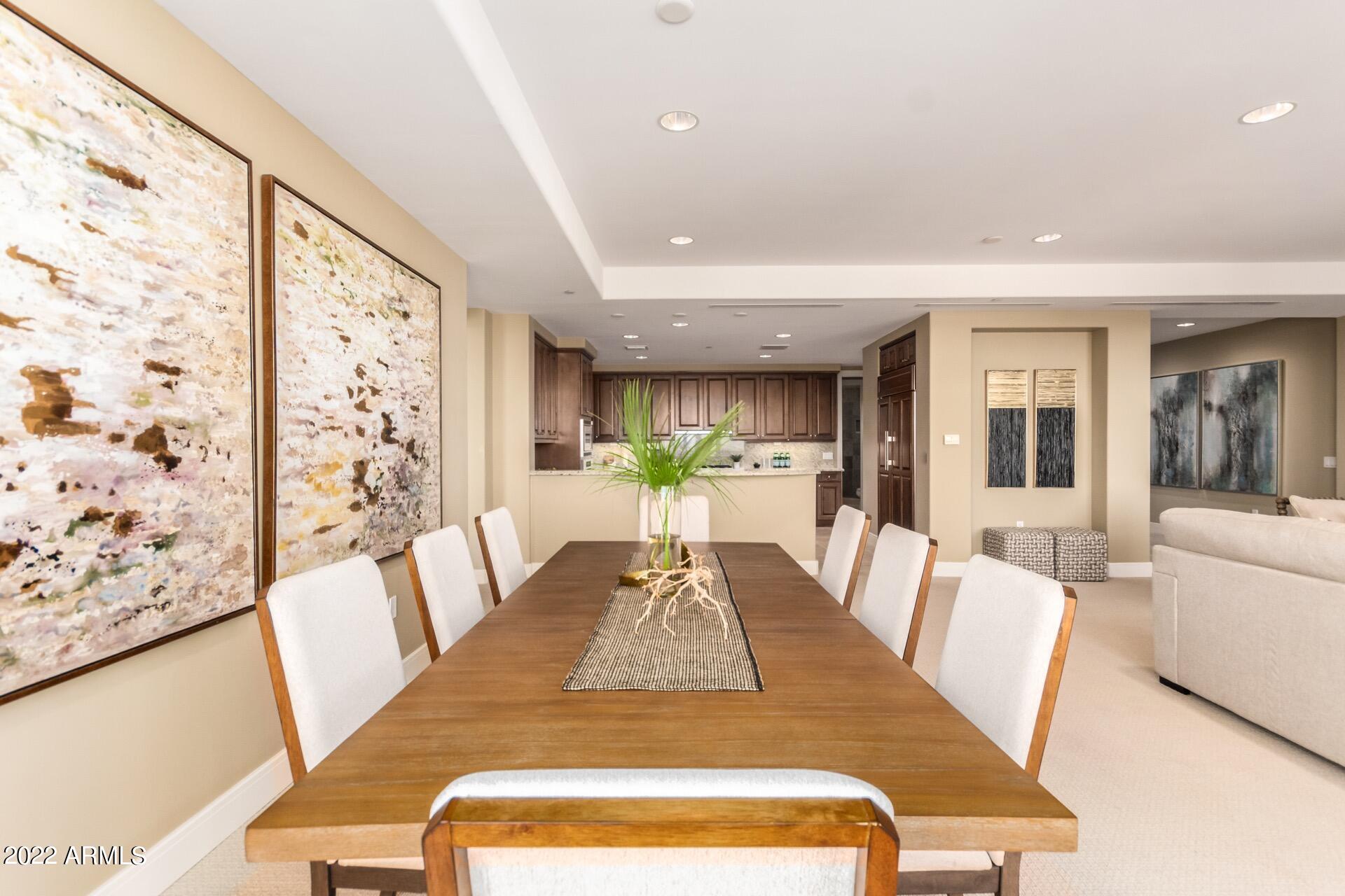 2211 East Camelback Road, Unit 1104 Phoenix, AZ 85016 - Photo 11 of 43 a view of a dining room with furniture window and wooden floor