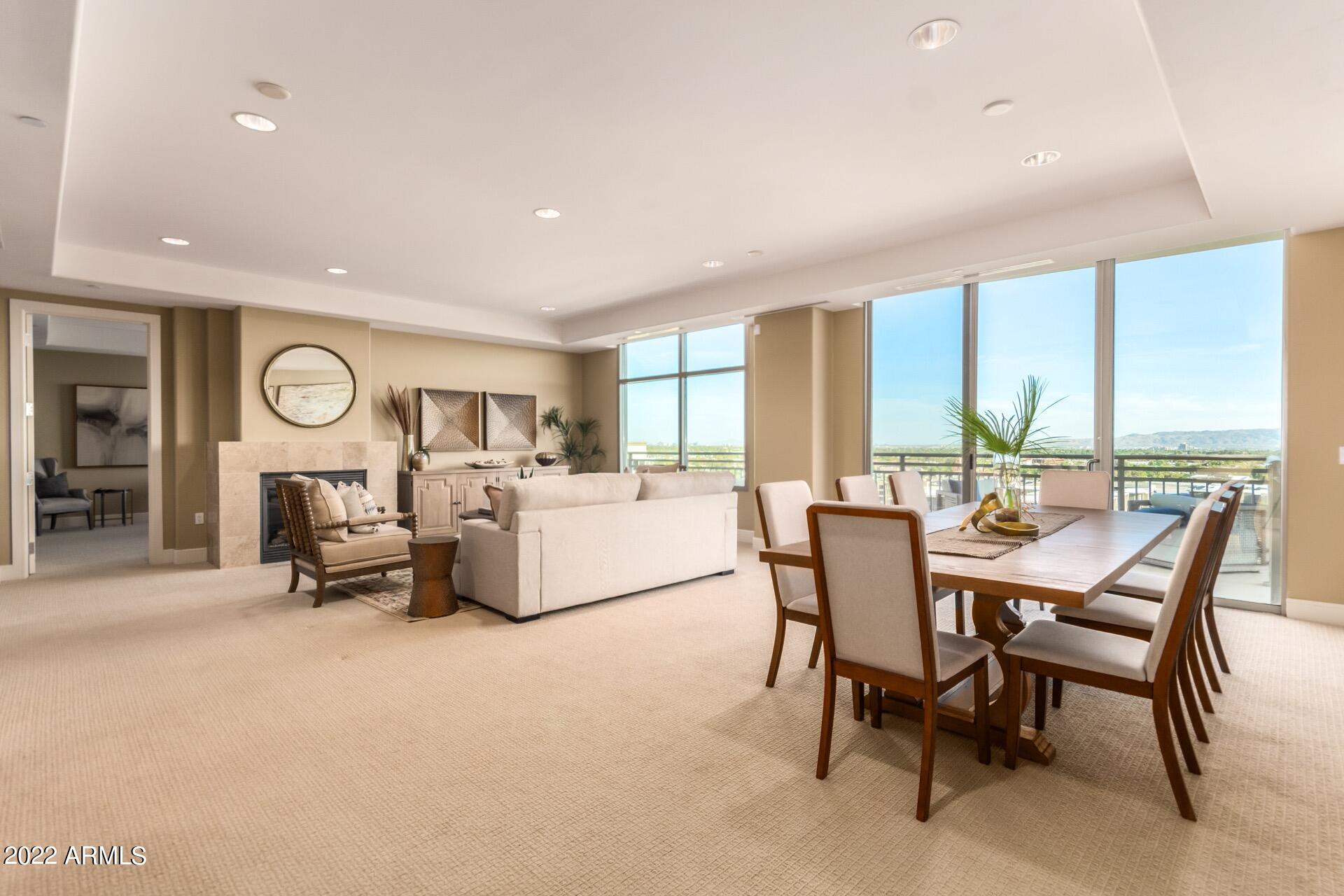 2211 East Camelback Road, Unit 1104 Phoenix, AZ 85016 - Photo 2 of 43 a dining room with furniture and a large window