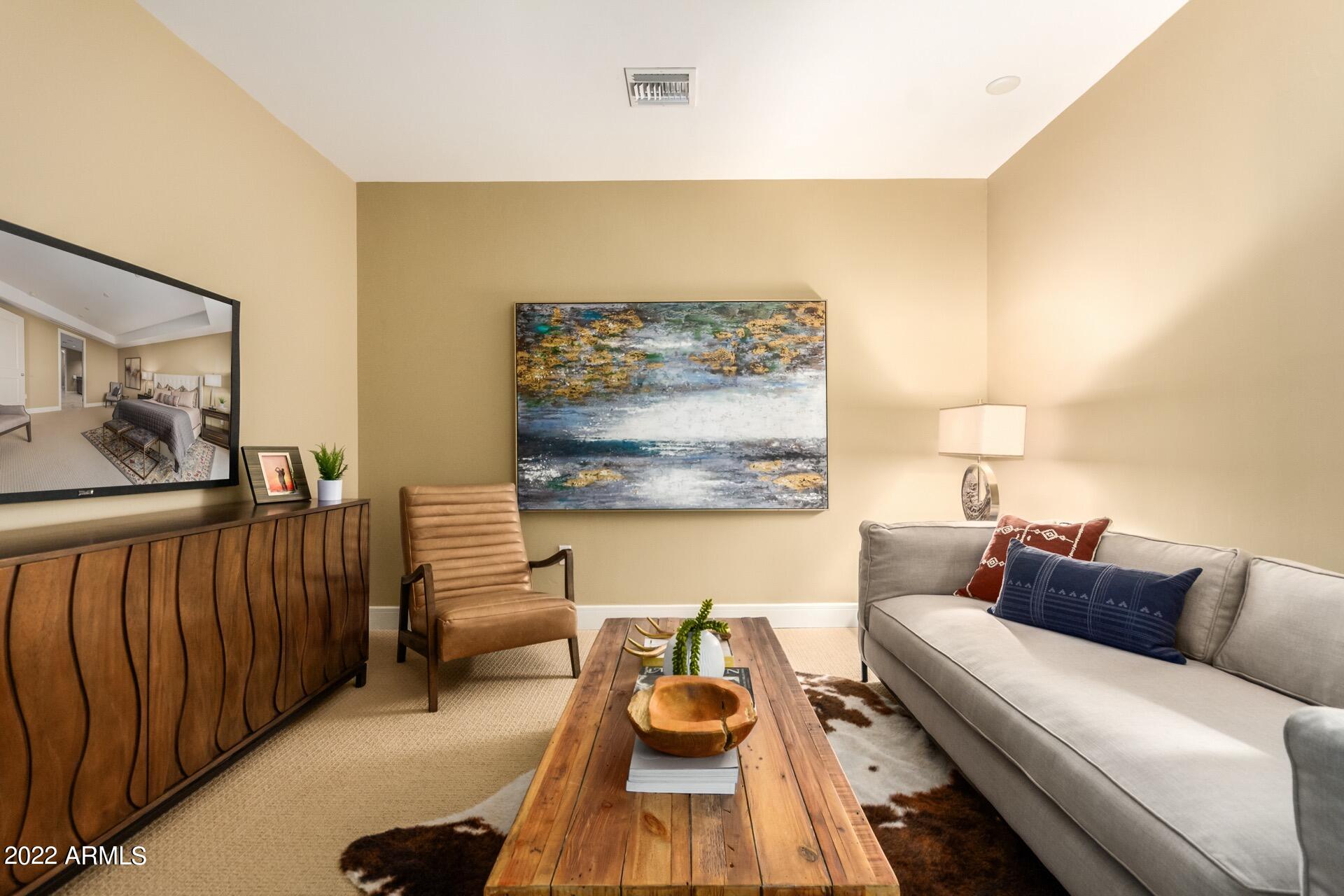 2211 East Camelback Road, Unit 1104 Phoenix, AZ 85016 - Photo 27 of 43 a living room with furniture and wooden floor