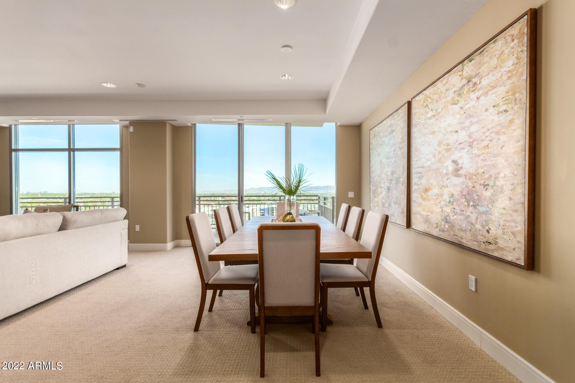 2211 East Camelback Road, Unit 1104 Phoenix, AZ 85016 - Photo 10 of 43 a view of a dining room with furniture window and outside view