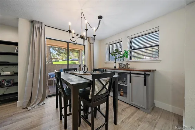 a view of a dining room with furniture window and wooden floor