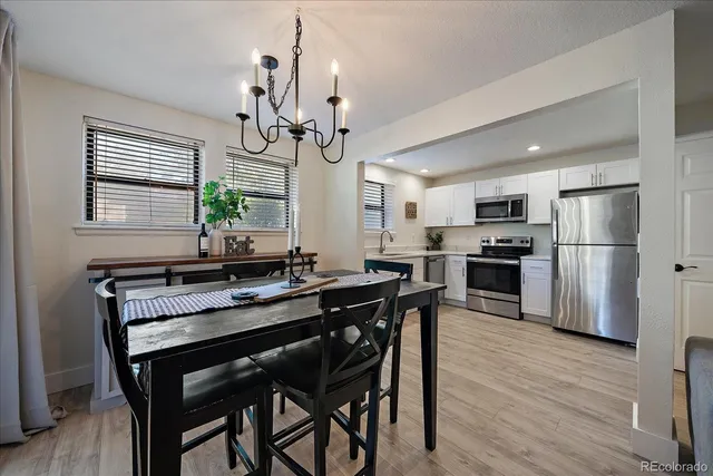 a view of a dining room with furniture window and wooden floor