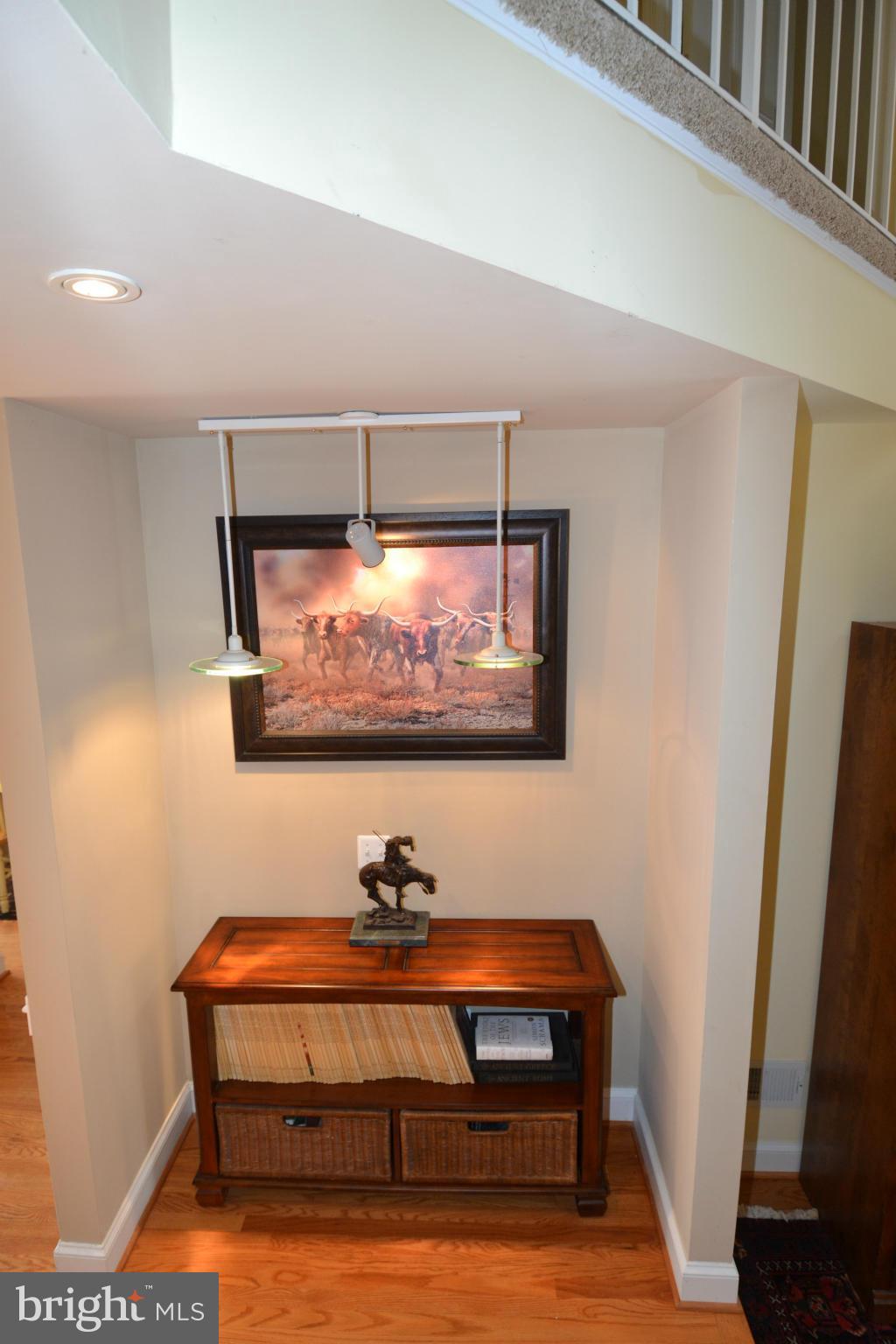 11634 Chapel Cross Way Reston, VA 20194 - Photo 14 of 30 a room with furniture wall painting and a potted plant
