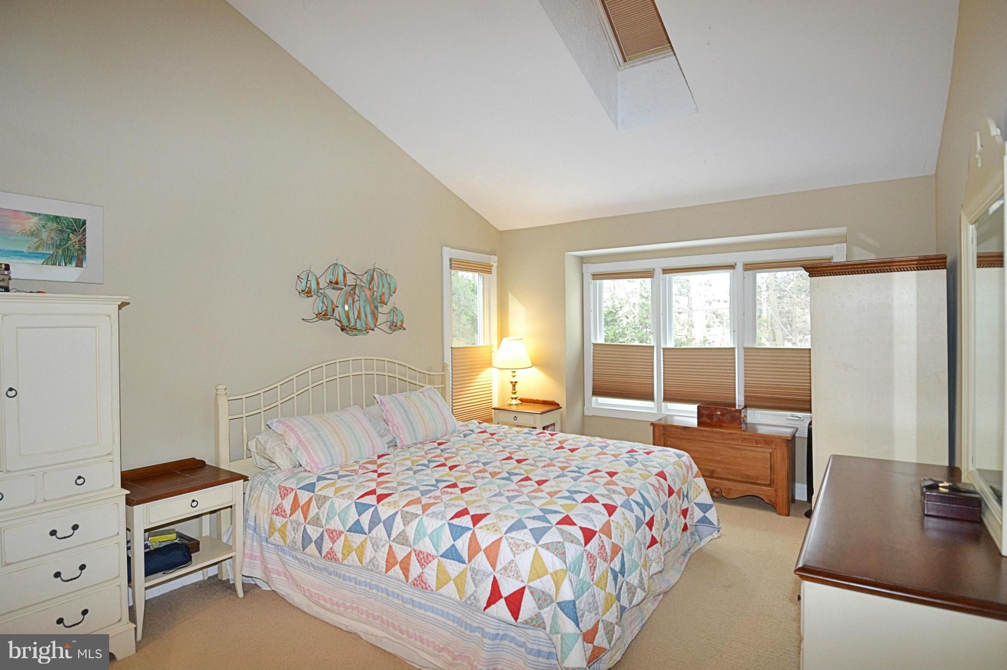 11634 Chapel Cross Way Reston, VA 20194 - Photo 18 of 30 a bedroom with a bed and a large window
