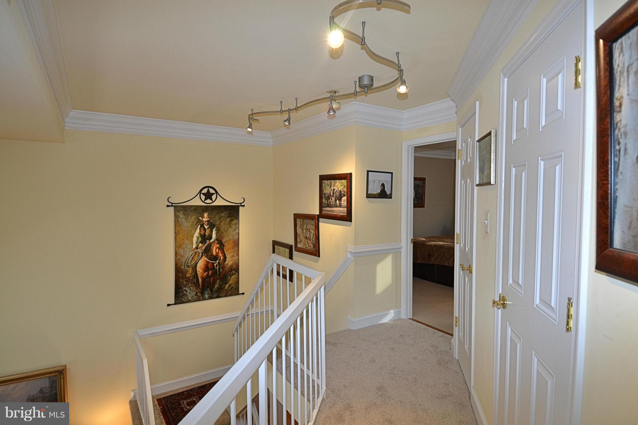 11634 Chapel Cross Way Reston, VA 20194 - Photo 21 of 30 a view of a hallway with wooden floor and entryway