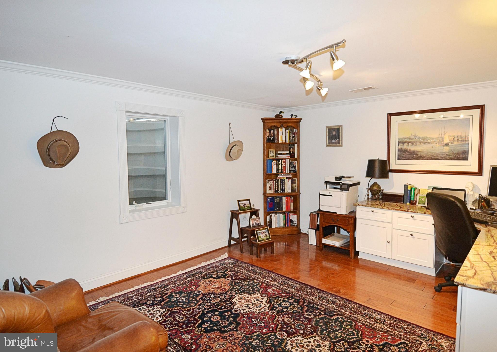 11634 Chapel Cross Way Reston, VA 20194 - Photo 24 of 30 a living room with furniture and a window