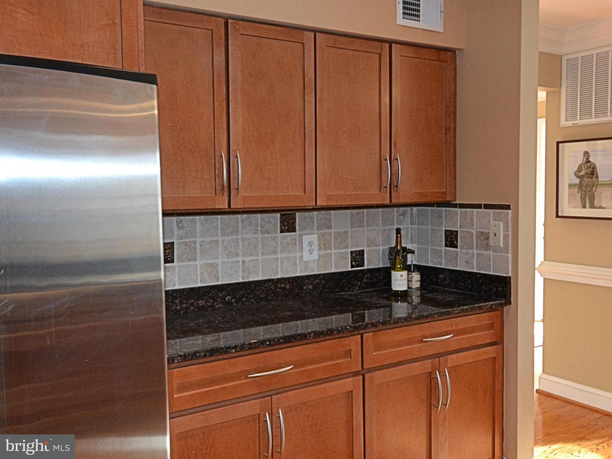 11634 Chapel Cross Way Reston, VA 20194 - Photo 7 of 30 a view of a sink and dishwasher in a kitchen