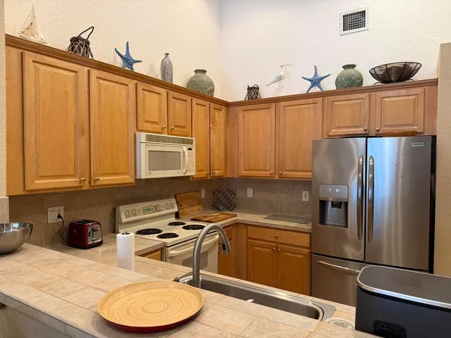 a bedroom with a bed dresser and a window