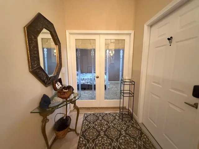 a bathroom with a granite countertop shower and a toilet
