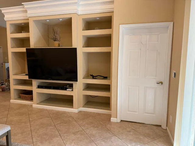 a bedroom with a bed and a table in it