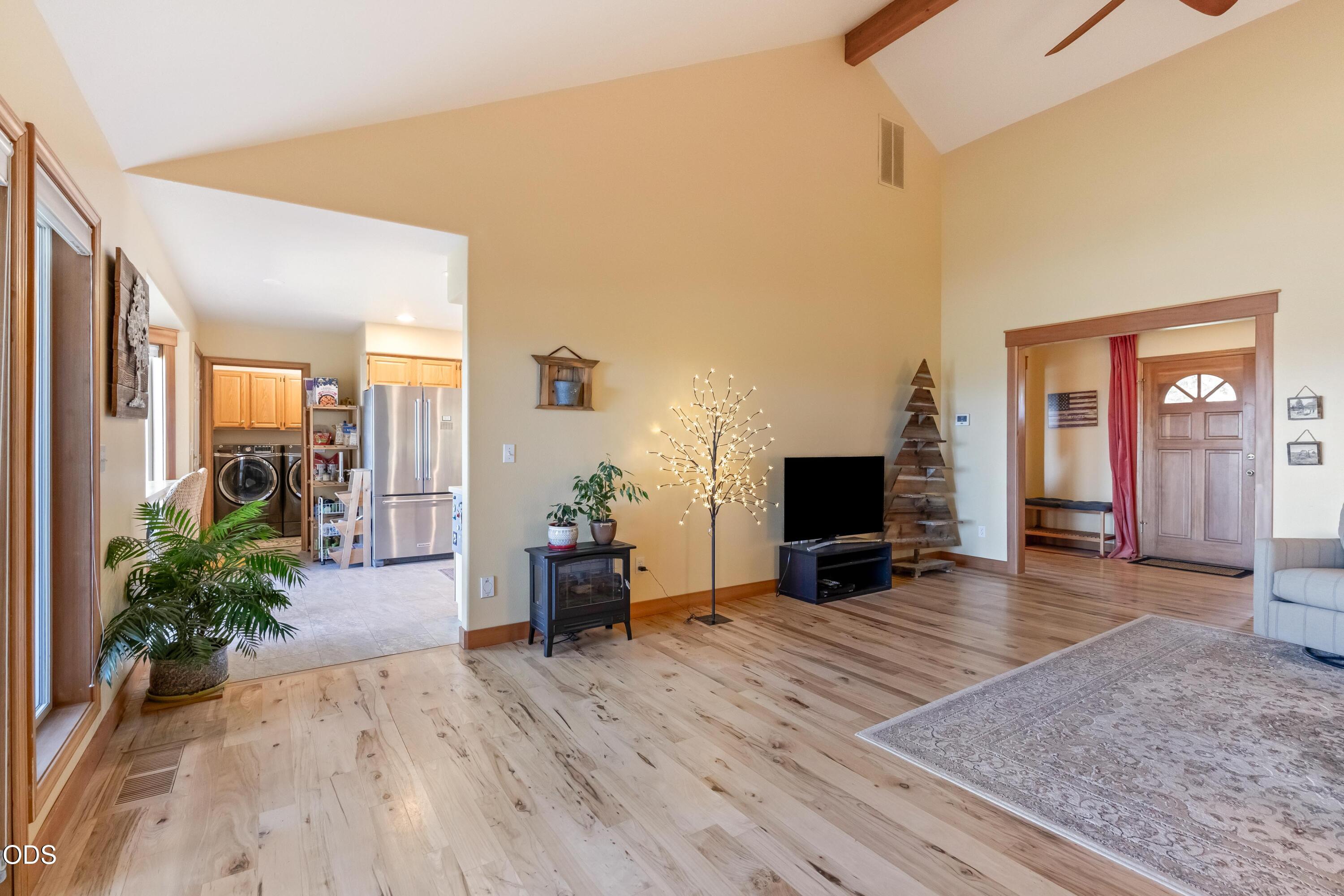 13753 South Sego Lily Road Powell Butte, OR 97753 - Photo 5 of 46 a view of a livingroom with furniture and a flat screen tv