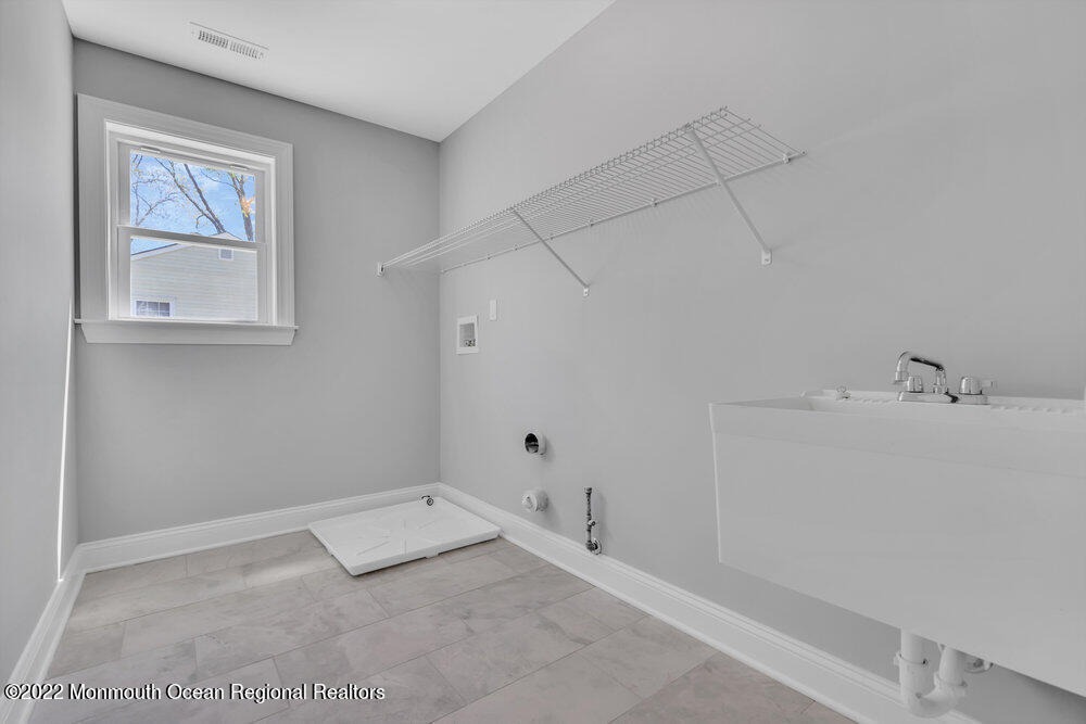 10 Sander Way Bayville, NJ 08721 - Photo 13 of 30 a view of a room with racks on the wall