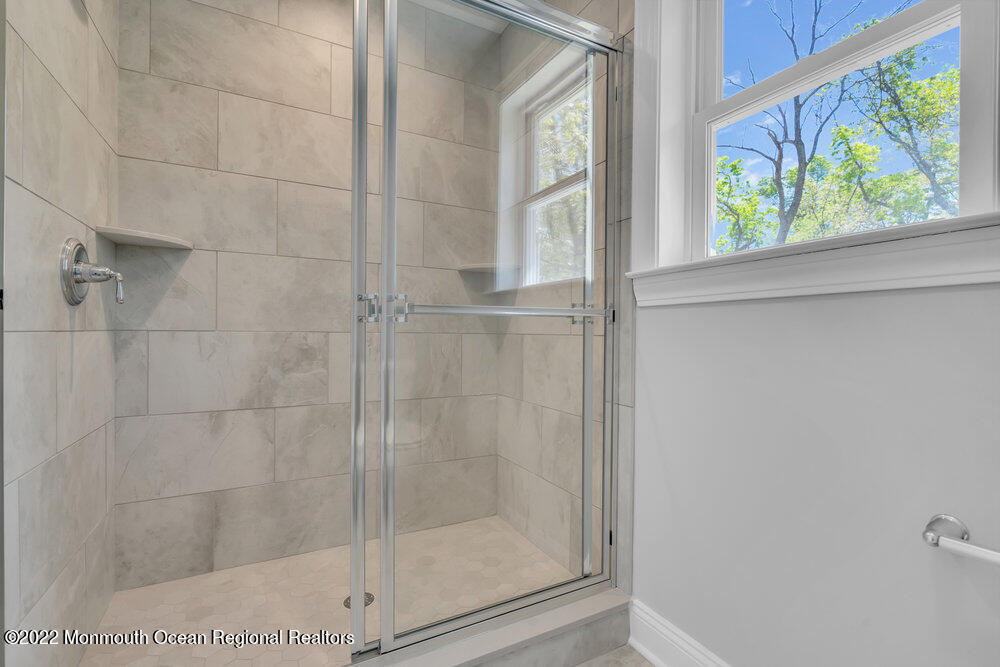 10 Sander Way Bayville, NJ 08721 - Photo 23 of 30 a bathroom with a glass shower door