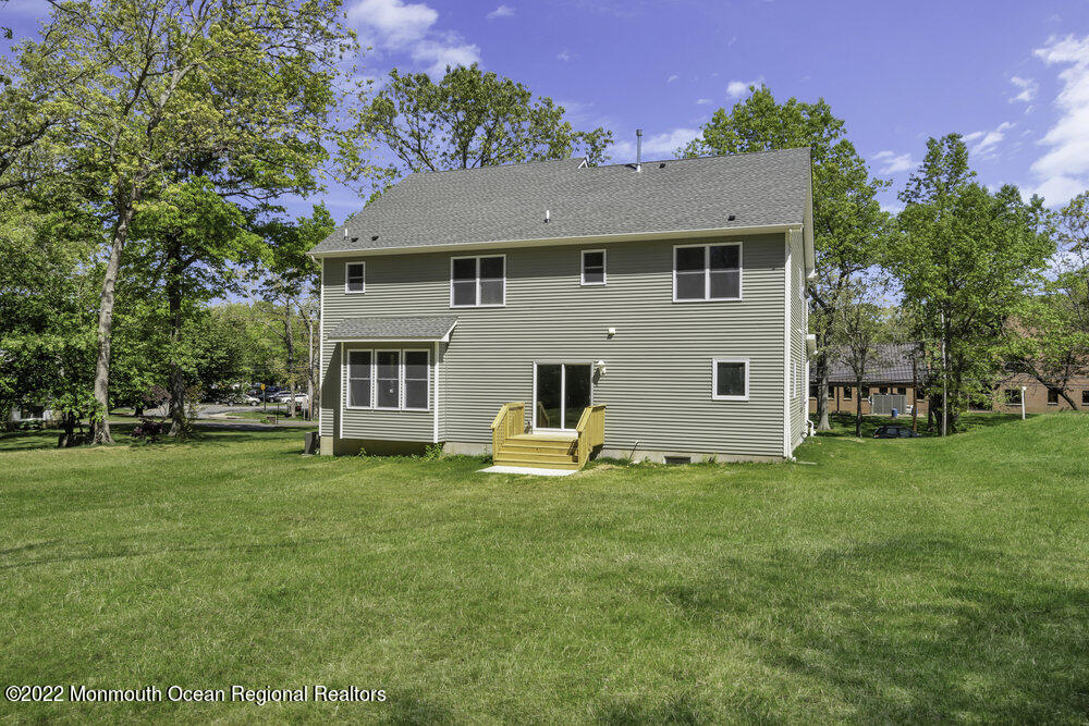 10 Sander Way Bayville, NJ 08721 - Photo 30 of 30 a view of a house with a big yard and large trees