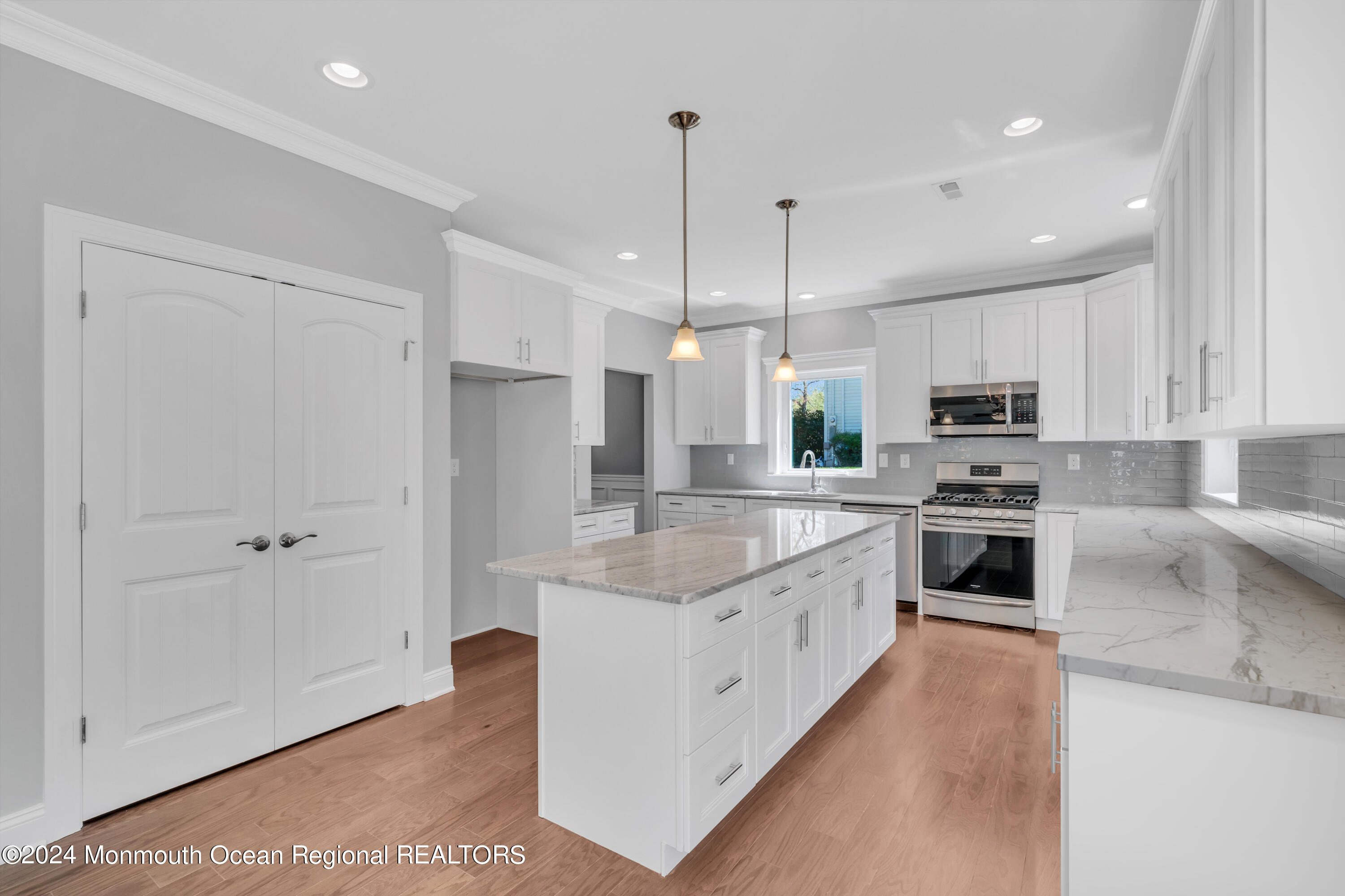 10 Sander Way Bayville, NJ 08721 - Photo 5 of 30 a large kitchen with granite countertop a large counter top a sink stainless steel appliances and cabinets