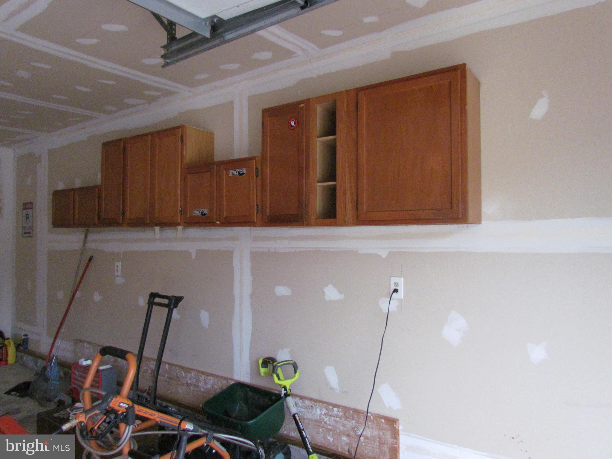 12923 Bogby Road Baltimore, MD 21220 - Photo 18 of 19 Garage Area with Storage and shelves