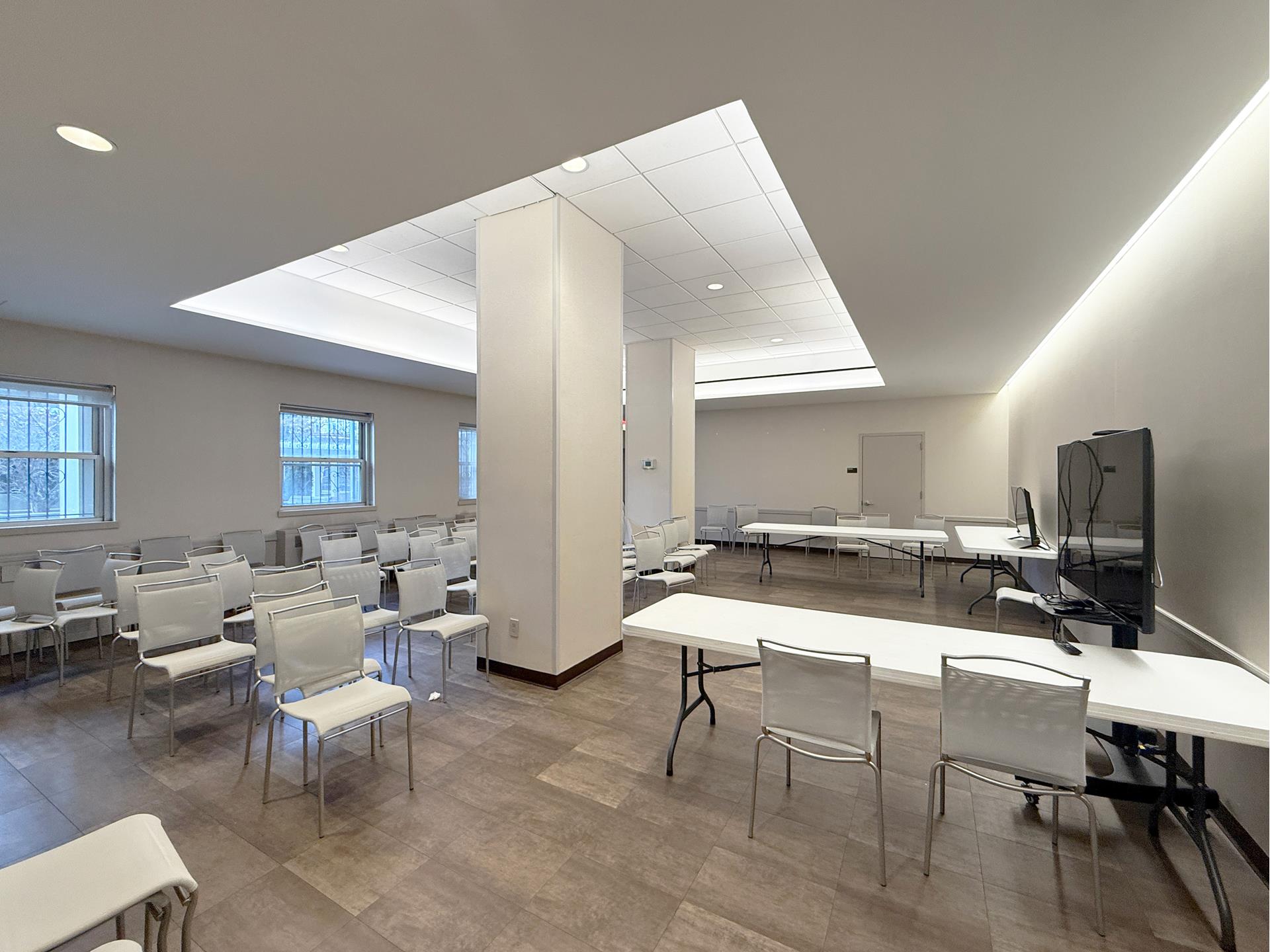 75 Henry Street, Unit 14C Brooklyn, NY 11201 - Photo 14 of 17 a room with lots of furniture and a wooden floor