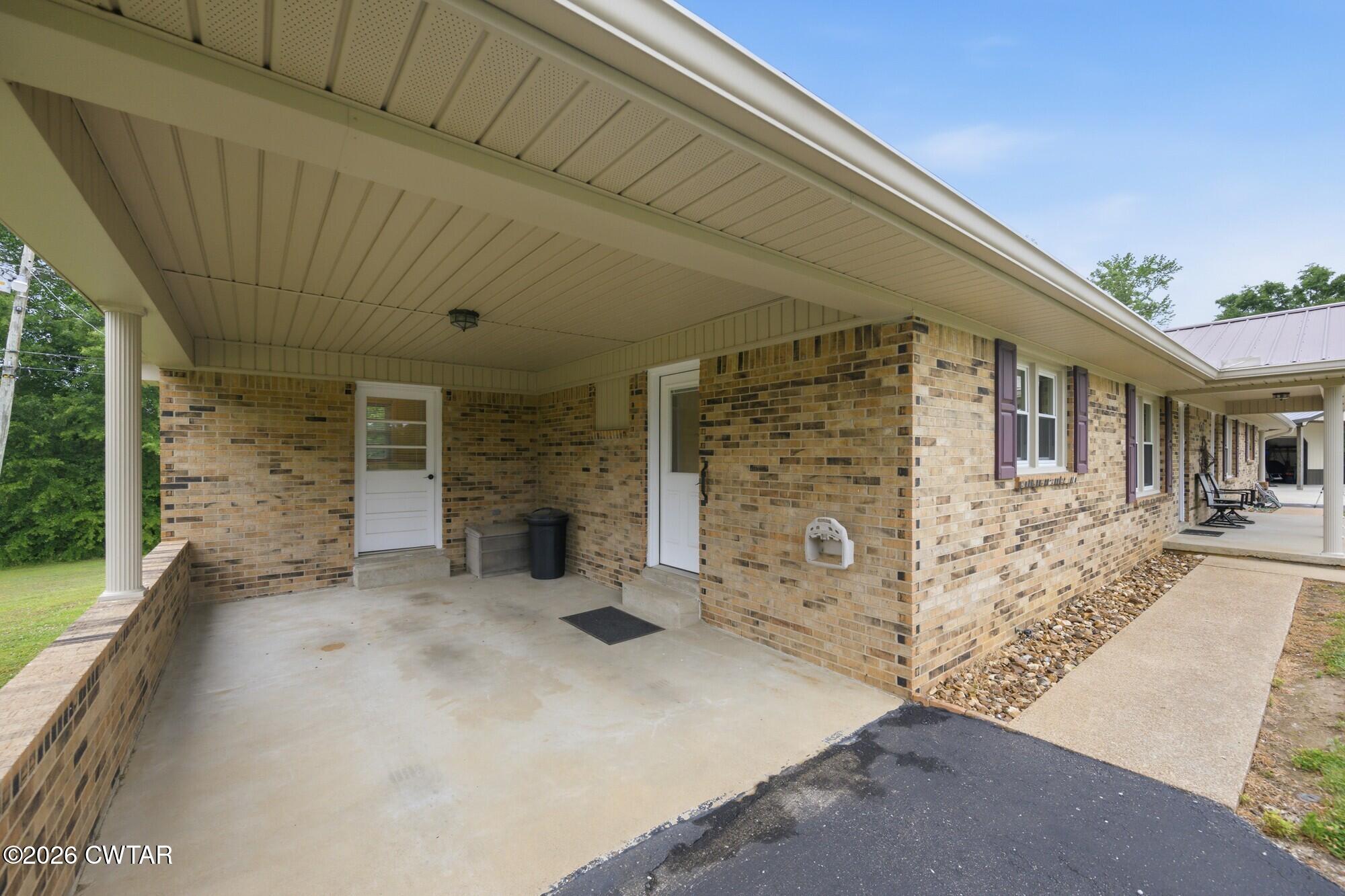 944 Brooksie Thompson Road Decaturville, TN 38329 - Photo 32 of 47 front view of a house with brick walls