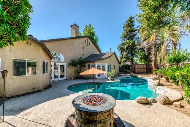 a view of a backyard with a patio
