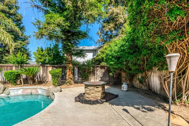 a view of a house with backyard porch and sitting area