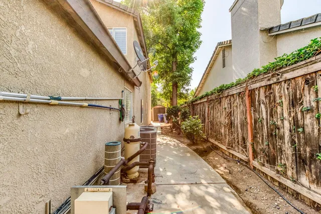 a view of backyard of house with outdoor seating