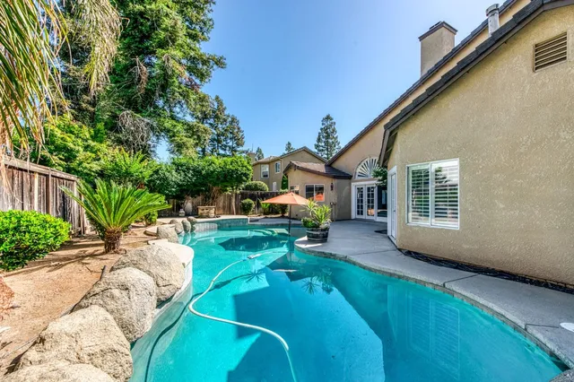 a view of a house with a yard and garage