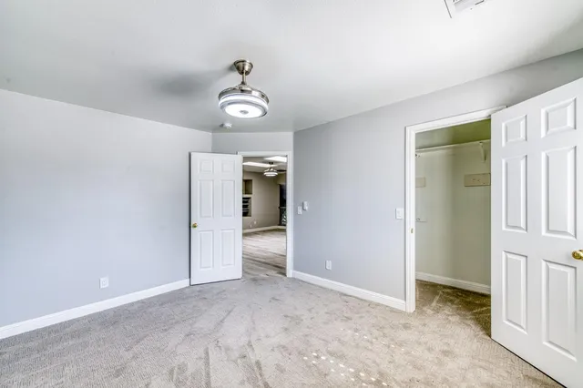 a view of a room with a sink and a mirror