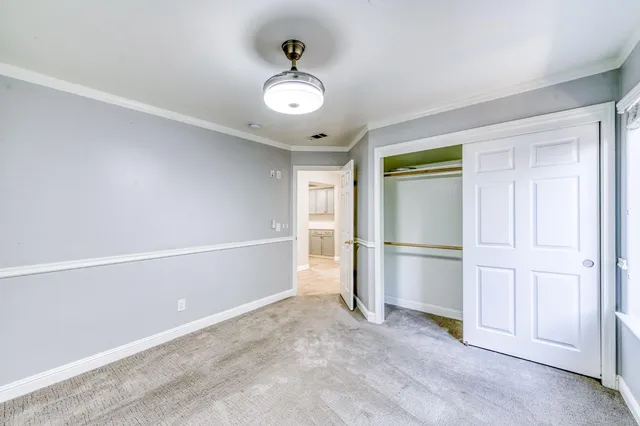 a kitchen with stainless steel appliances a stove top oven a sink and a refrigerator