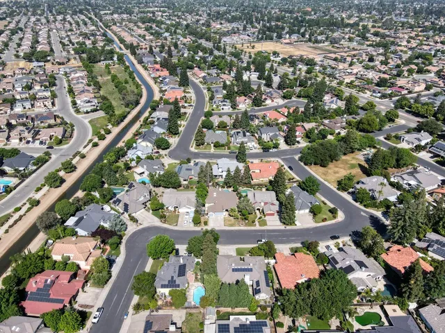 an aerial view of a house with outdoor space
