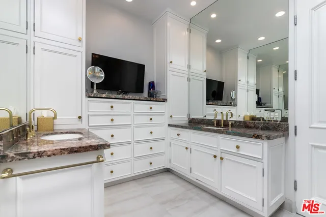 a bedroom with a bed and a table