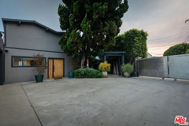 a living room with furniture and a kitchen view