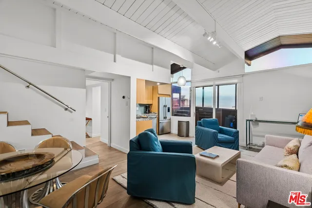 a kitchen with stainless steel appliances a refrigerator stove and sink