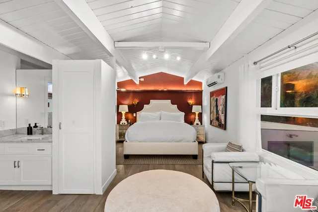 a bathroom with a granite countertop sink a mirror and a shower