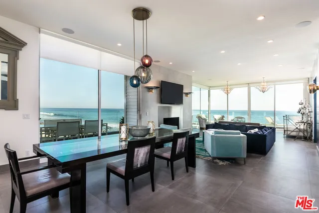 a very nice looking dining room with a table and chairs