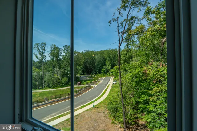 a view of a balcony with yard