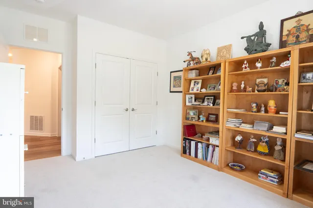 a view of a livingroom with shelves