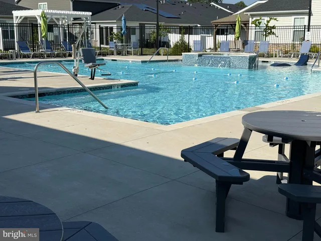 a view of a backyard with sitting area