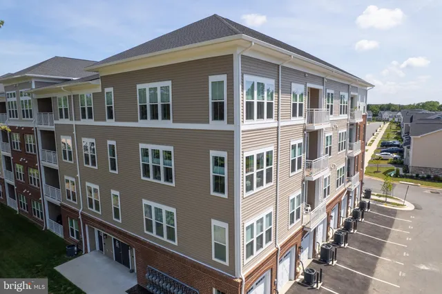 a front view of a building with glass windows