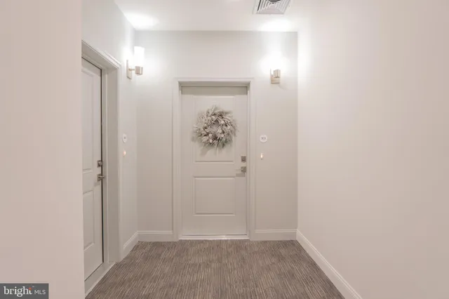 a view of a hallway with entryway
