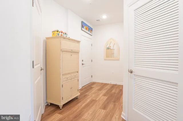 a view of an entryway with wooden floor