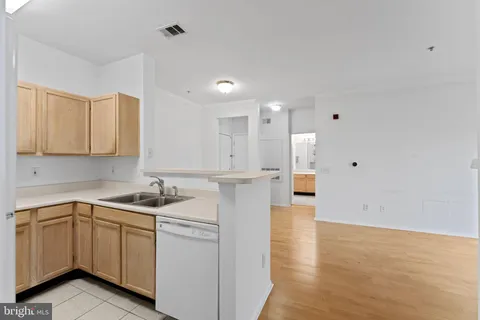 a kitchen with a stove and a refrigerator