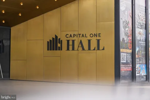 a view of a cars park in front of a building