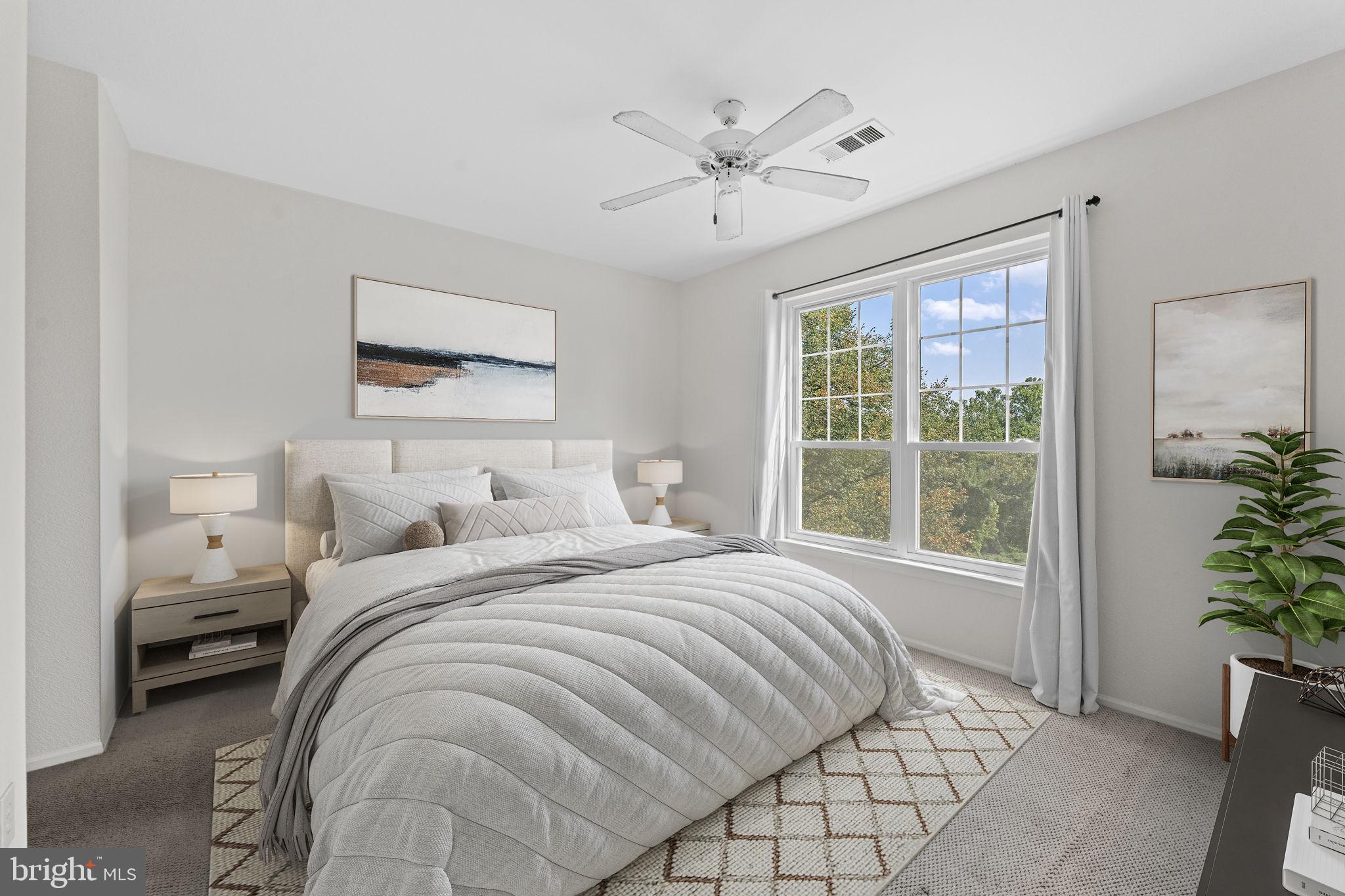 1591 Spring Gate Dr., Unit 3314 McLean, VA 22102 - Photo 2 of 56 a bedroom with a large bed and a window